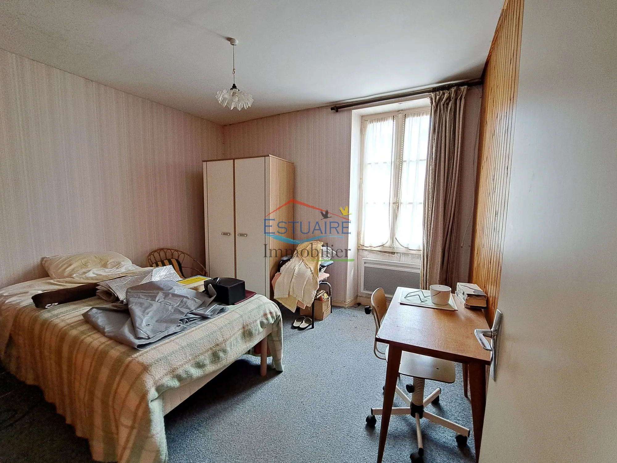 Investissement locatif à Casson avec deux logements et opportunités d'aménagement 