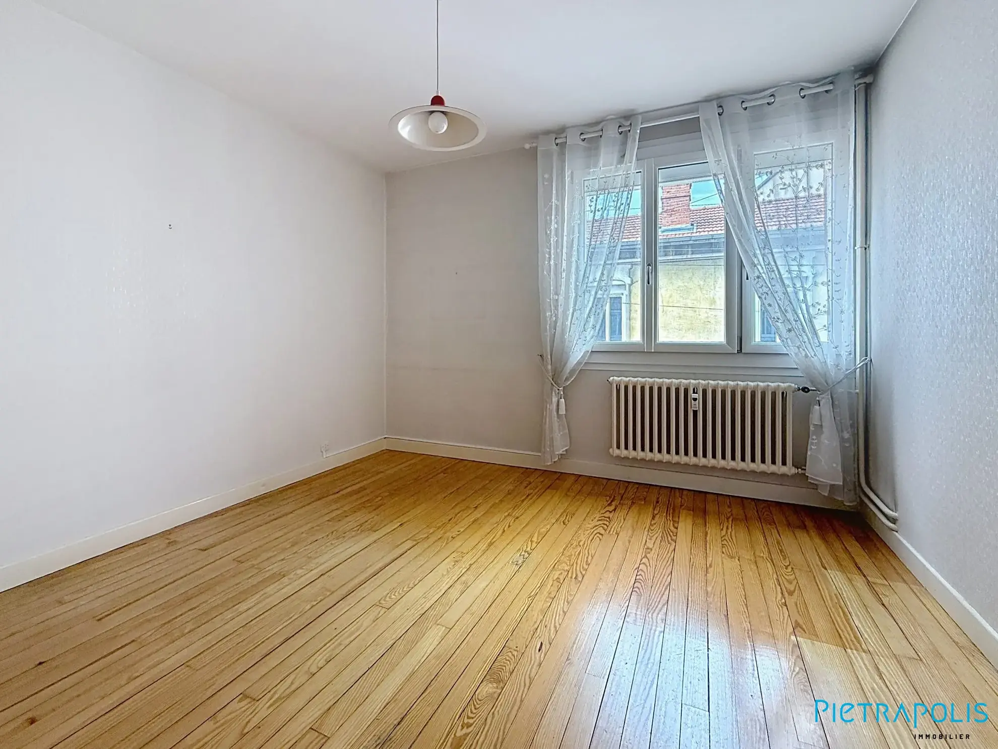 Vente appartement 4 pièces avec balcon à Roanne — proximité commerces et écoles 