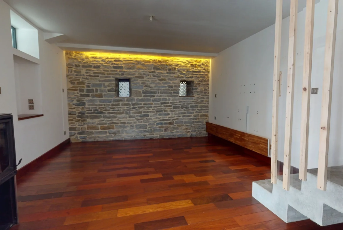 Maison en ossature bois de 130 m² à Evans avec terrasses et garage 