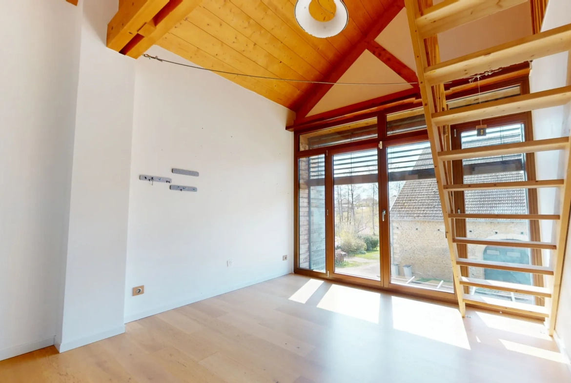 Maison en ossature bois de 130 m² à Evans avec terrasses et garage 