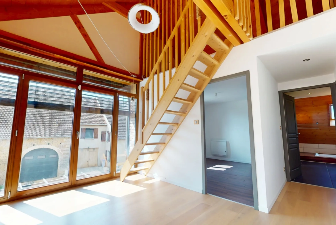 Maison en ossature bois de 130 m² à Evans avec terrasses et garage 