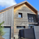 Maison en ossature bois de 130 m² à Evans avec terrasses et garage