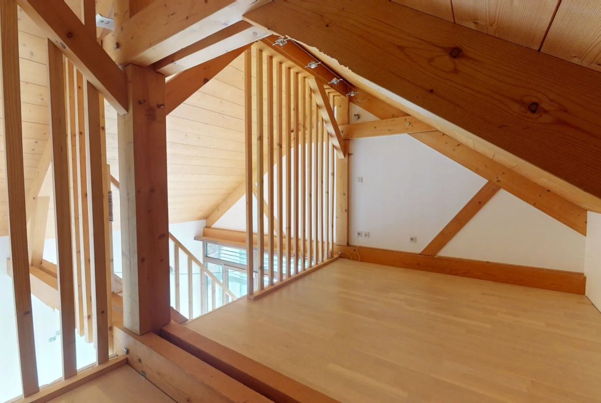Maison en ossature bois de 130 m² à Evans avec terrasses et garage 