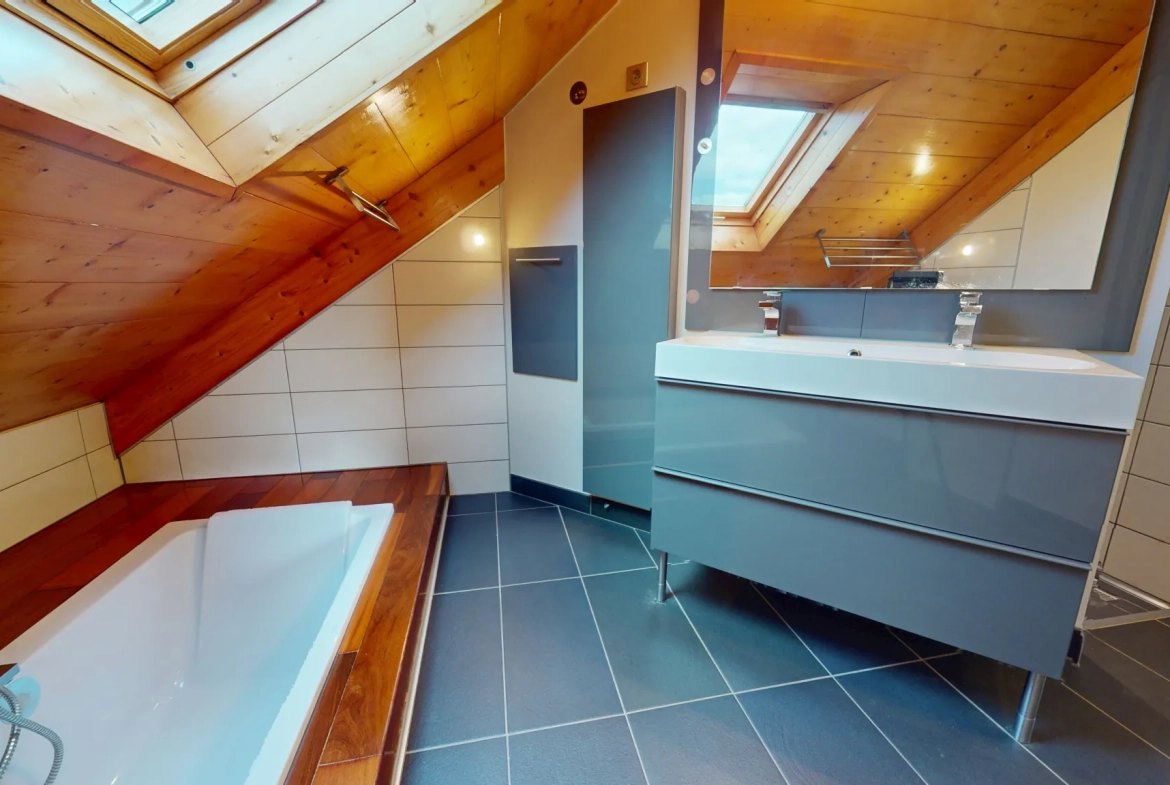 Maison en ossature bois de 130 m² à Evans avec terrasses et garage 