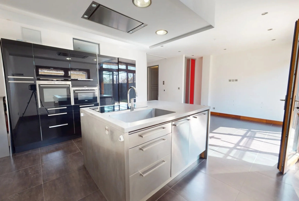 Maison en ossature bois de 130 m² à Evans avec terrasses et garage 