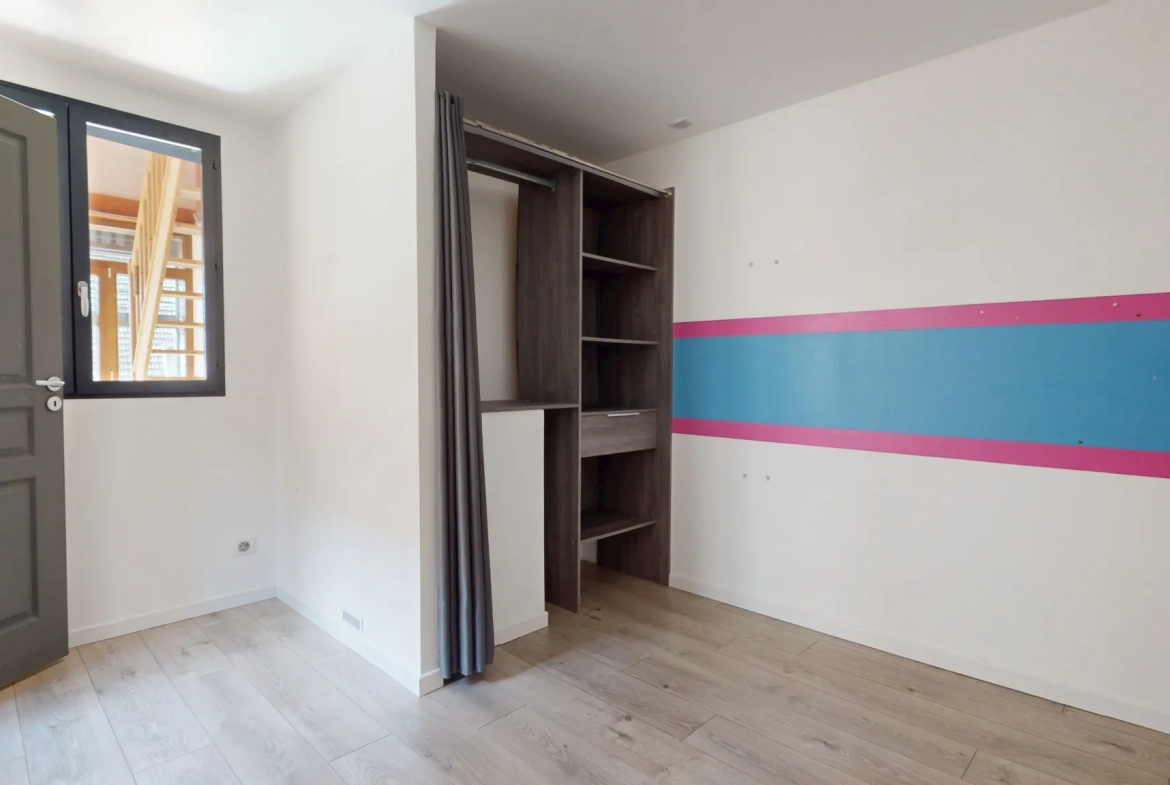 Maison en ossature bois de 130 m² à Evans avec terrasses et garage 