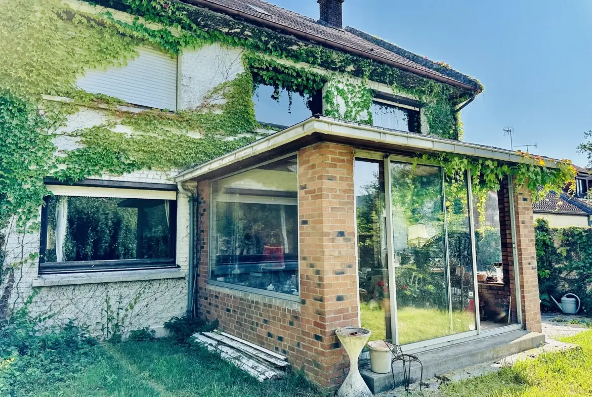 Belle maison familiale à Caudry avec 5 chambres, jardin et grand potentiel de rénovation 
