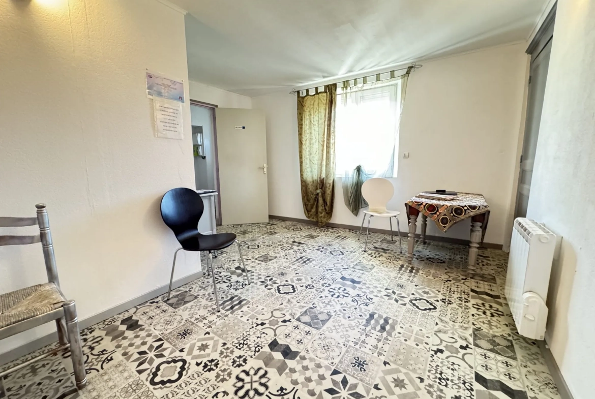 Maison de ville à Montluçon avec jardin et cave - Opportunité d'investissement 