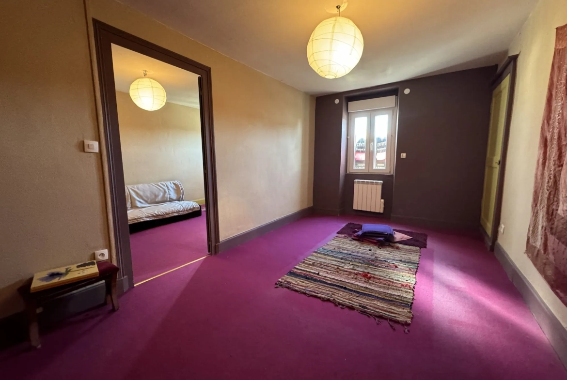 Maison de ville à Montluçon avec jardin et cave - Opportunité d'investissement 