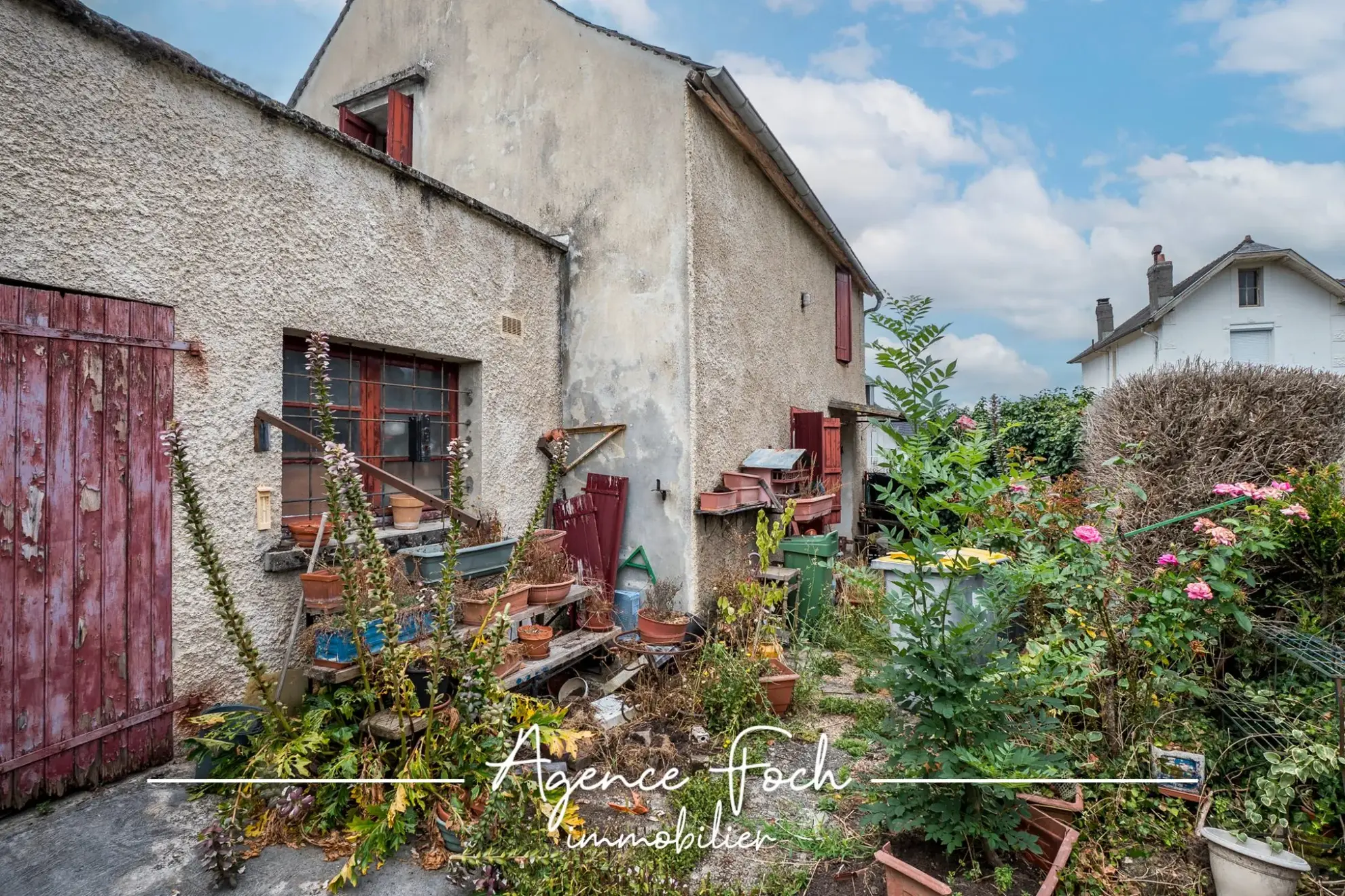 Maison de ville à rénover avec garage et jardin proche de Tarbes 