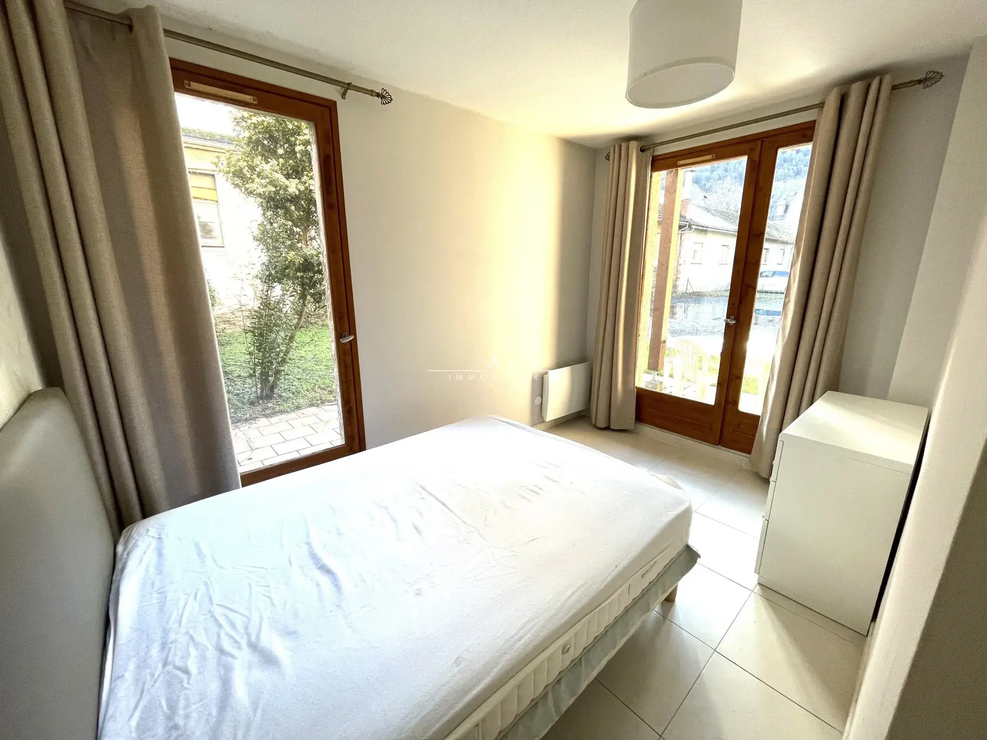 Appartement T2 rénové avec jardin à Luchon, vue dégagée, parking privé 