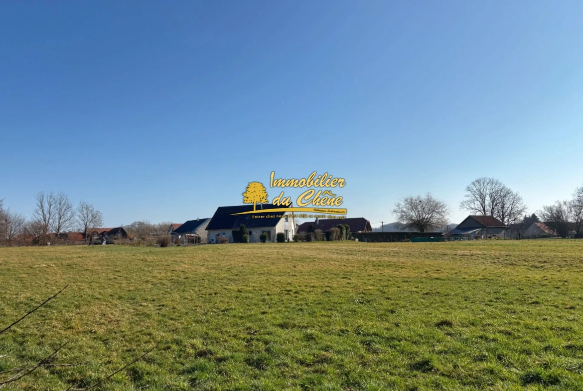 Terrain constructible à Bouhans-lès-Lure avec vue dégagée et faible aléa 