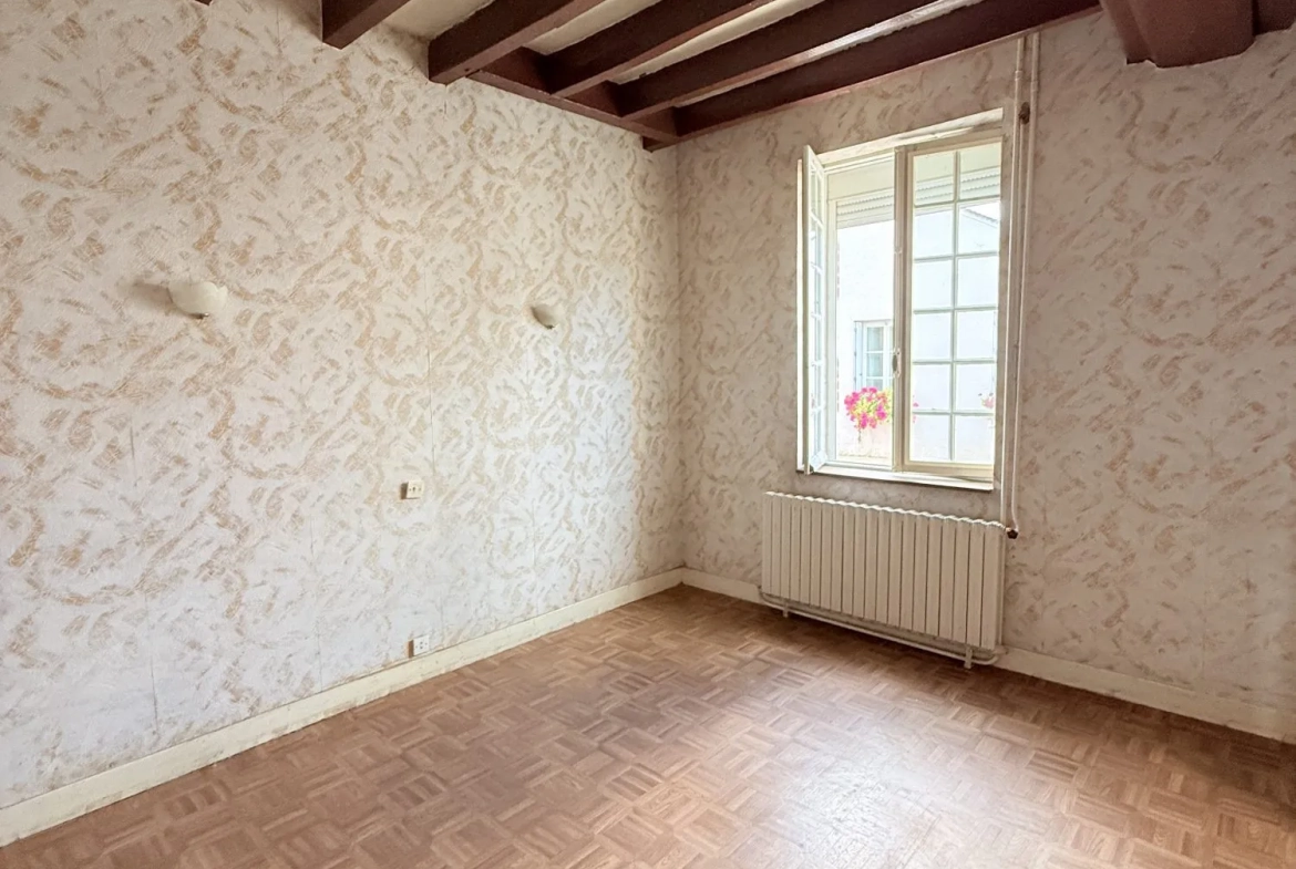 Maison de ville à Viglain avec 3 chambres et potentiel de rénovation 