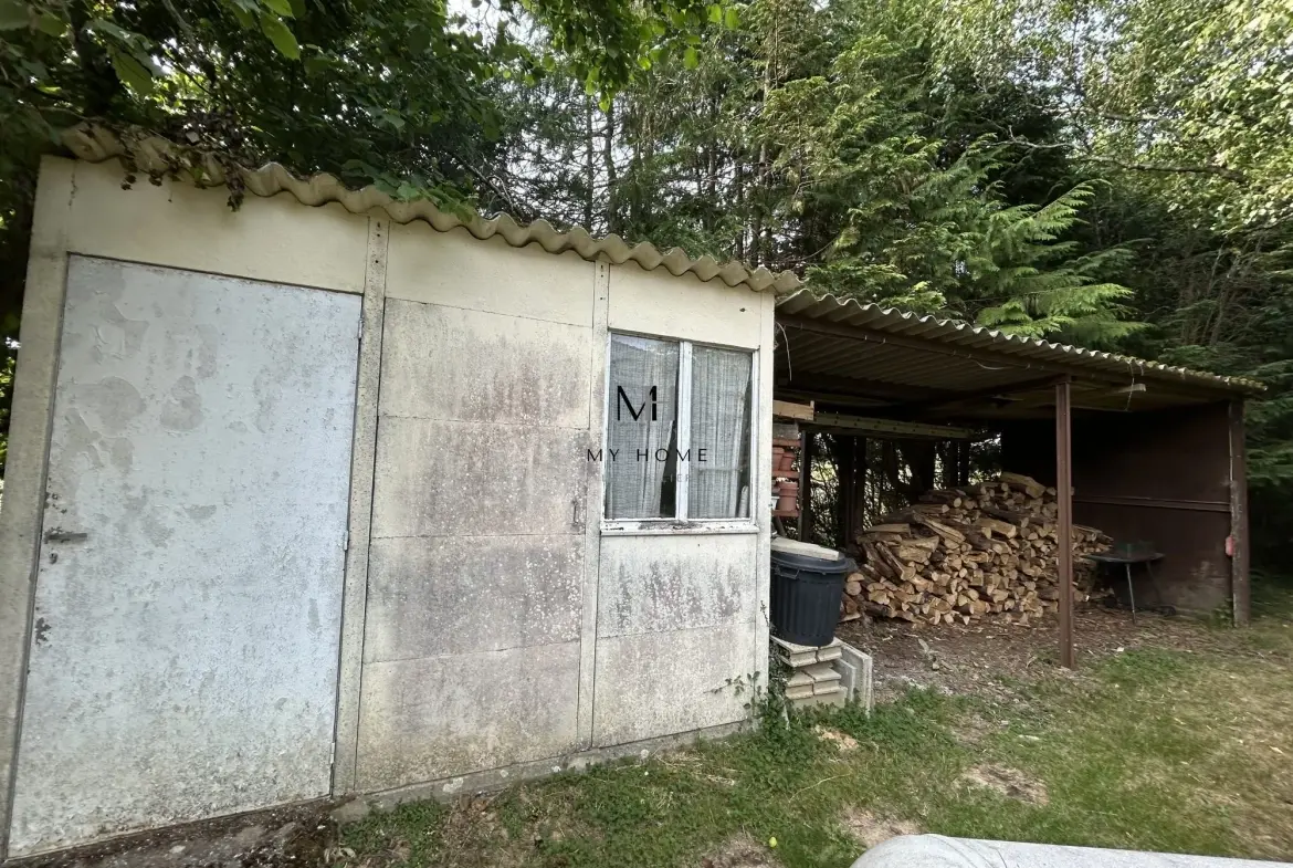 Maison de plain-pied à rénover à Lonrai - 3 chambres, garage, terrain clos 