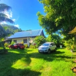 Terrain constructible de 909 m² à PAEA avec chalet à rénover, cadre paisible