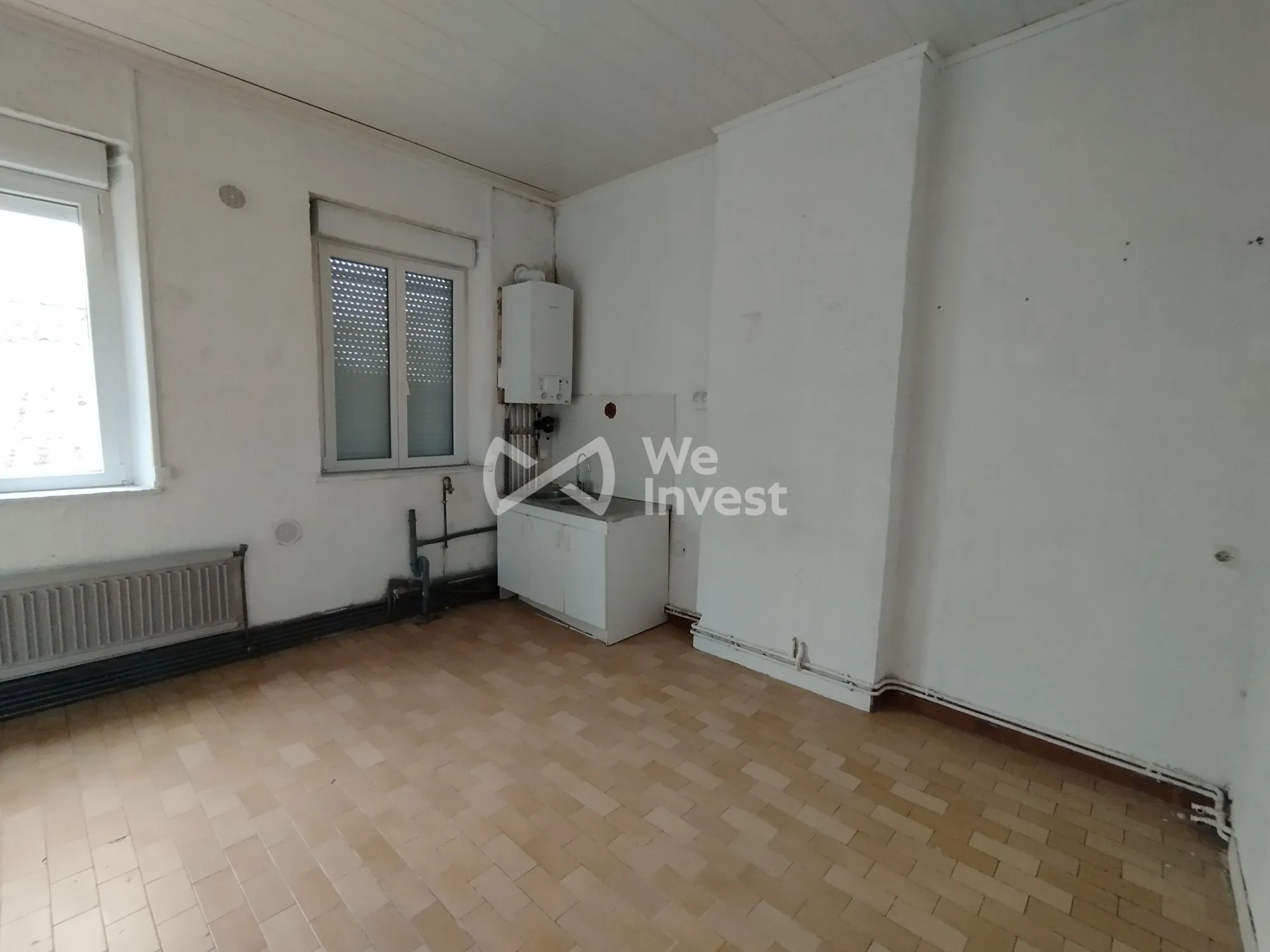 Investissement immobilier à Fourmies : immeuble de 2 appartements avec rapport locatif élevé 