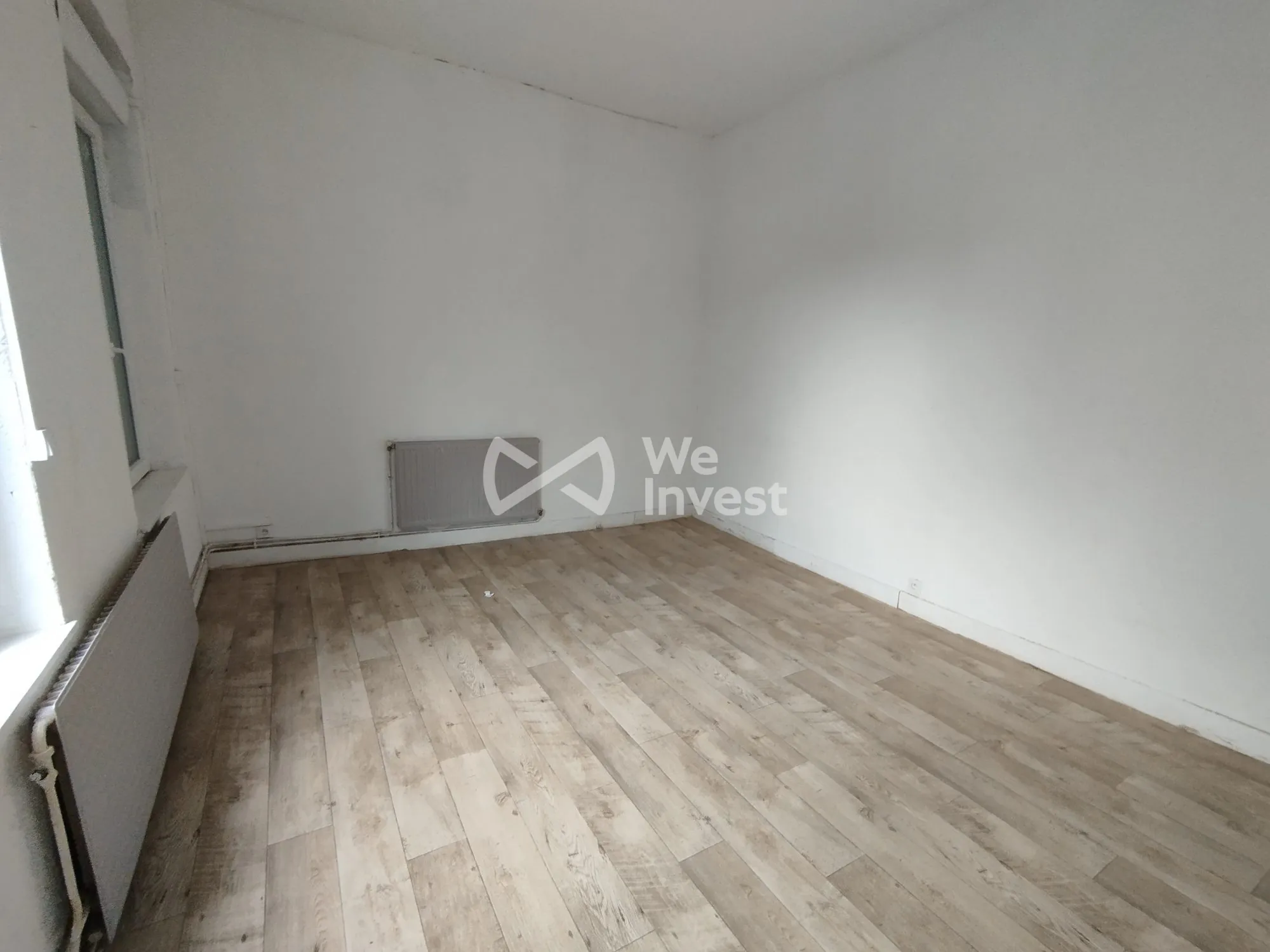 Investissement immobilier à Fourmies : immeuble de 2 appartements avec rapport locatif élevé 