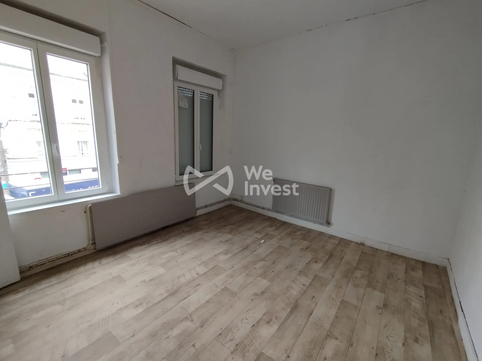 Investissement immobilier à Fourmies : immeuble de 2 appartements avec rapport locatif élevé 