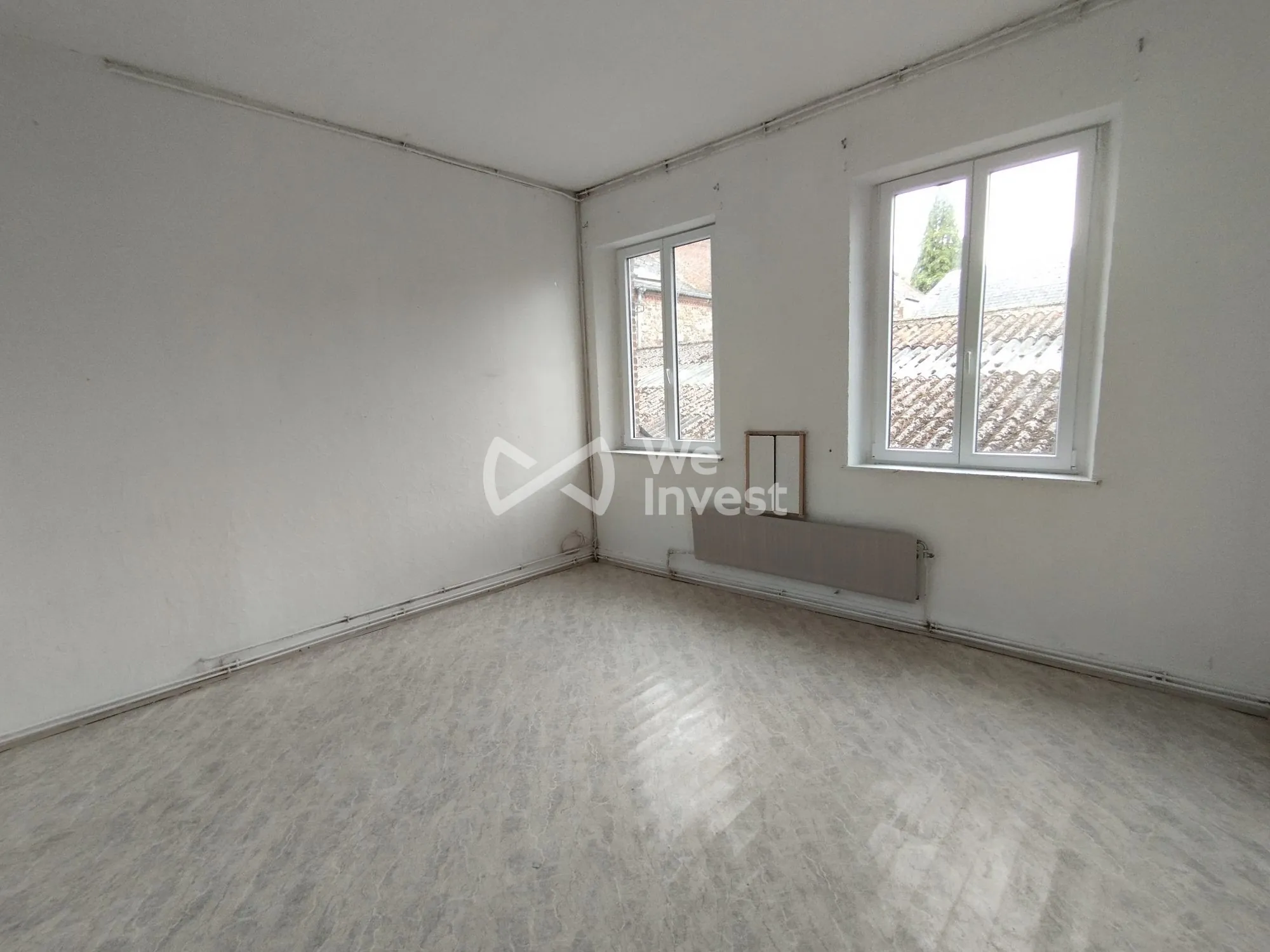 Investissement immobilier à Fourmies : immeuble de 2 appartements avec rapport locatif élevé 