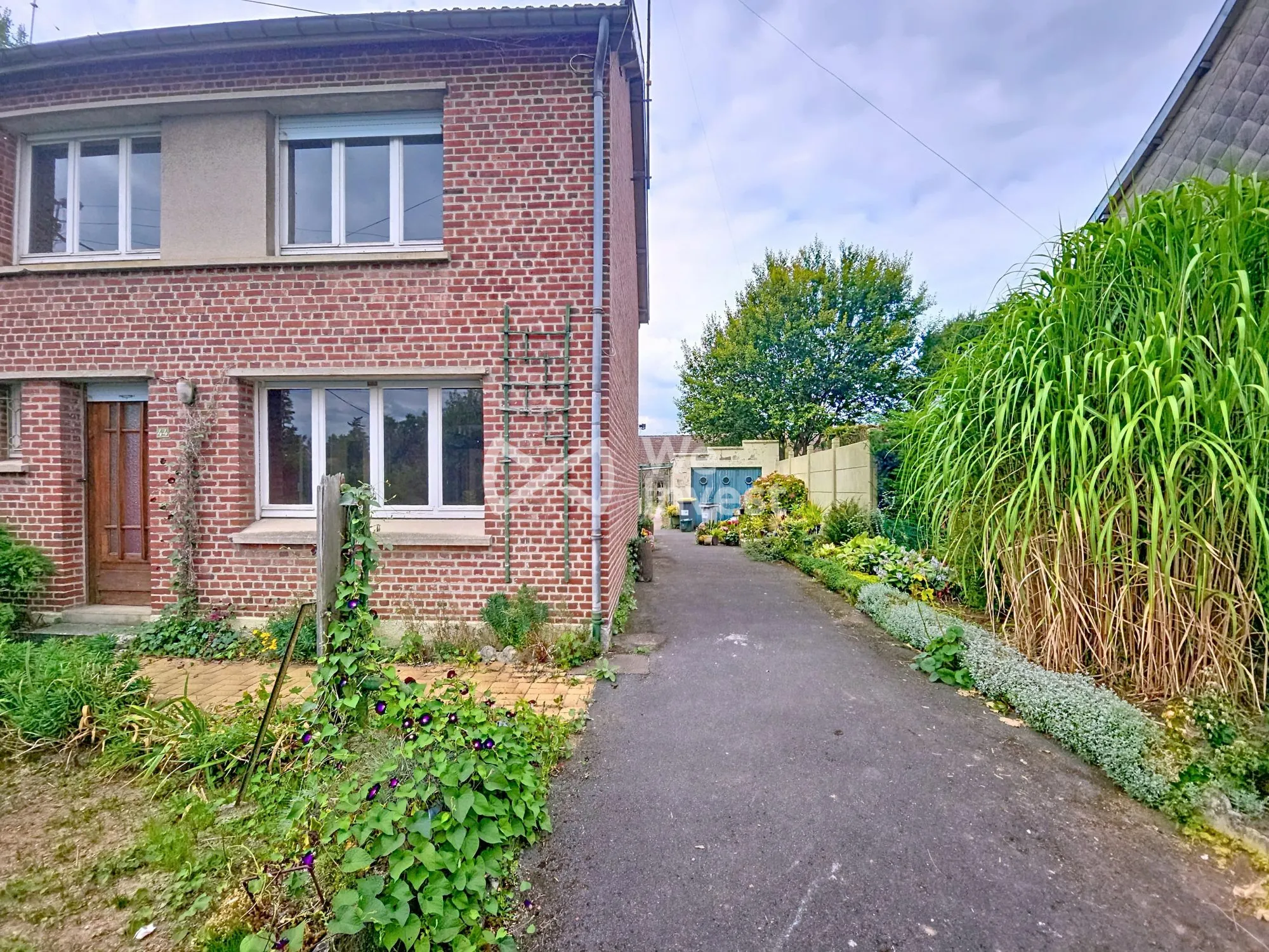 Maison à vendre à Berlaimont – 4 chambres, jardin, garage, potentiel de rénovation 