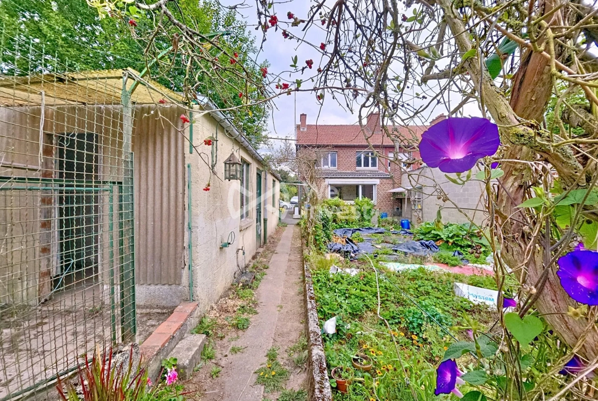 Maison à vendre à Berlaimont – 4 chambres, jardin, garage, potentiel de rénovation 