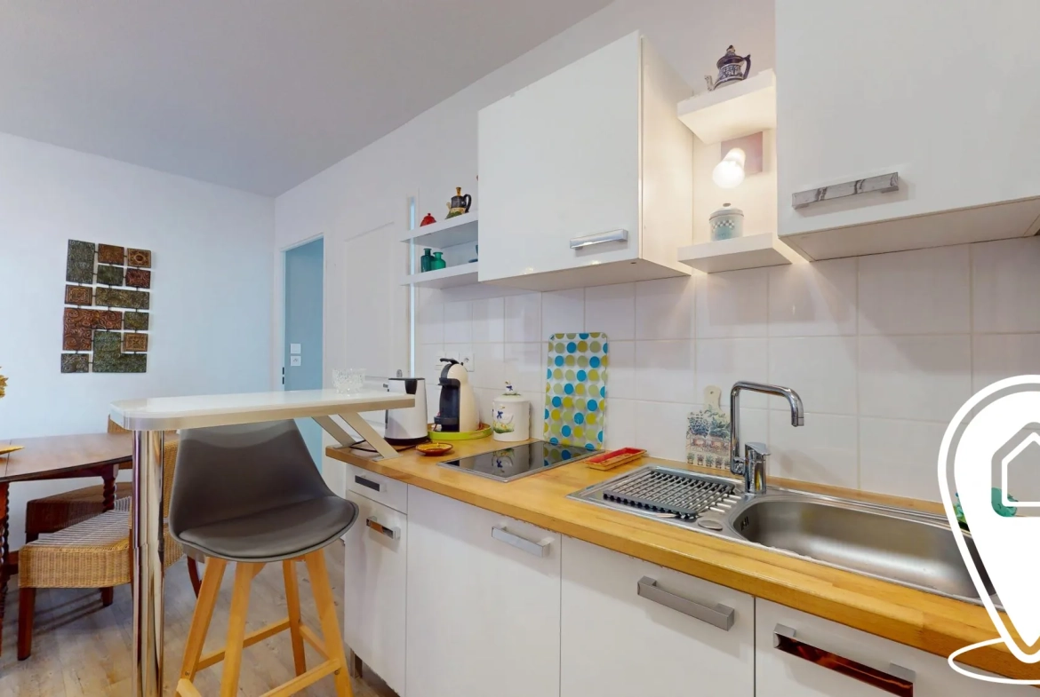 Appartement T2/T3 en rez-de-chaussée à Golbey avec terrasse et stationnement 