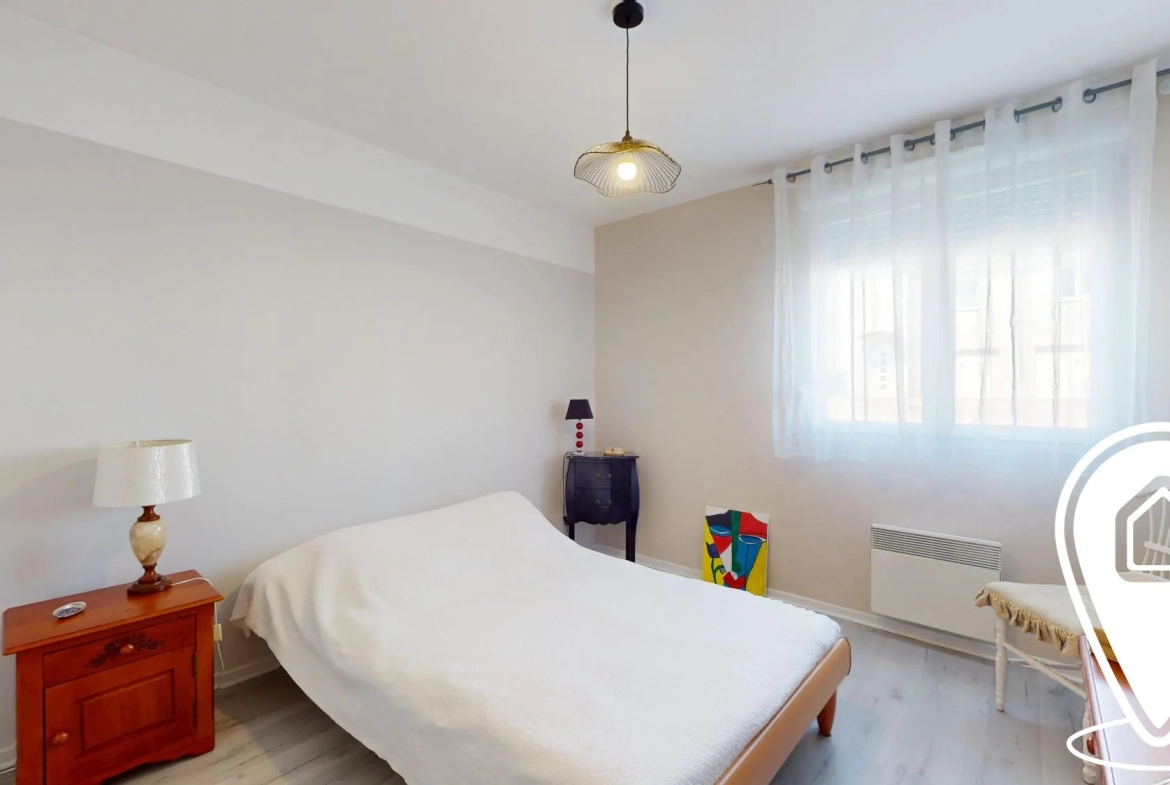 Appartement T2/T3 en rez-de-chaussée à Golbey avec terrasse et stationnement 