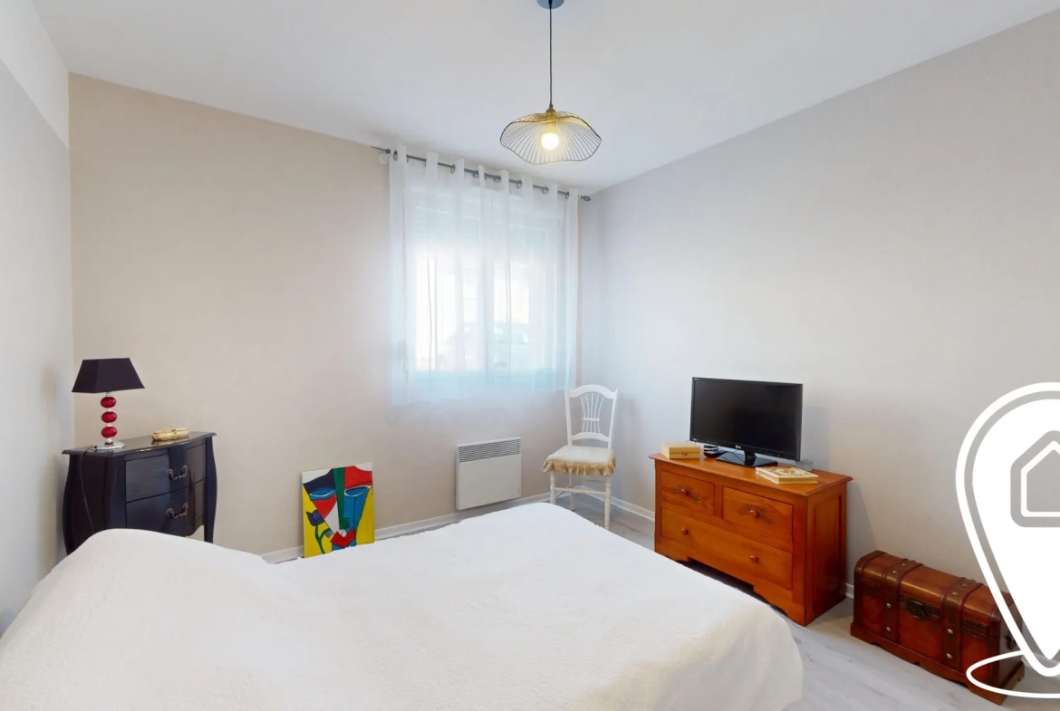 Appartement T2/T3 en rez-de-chaussée à Golbey avec terrasse et stationnement 
