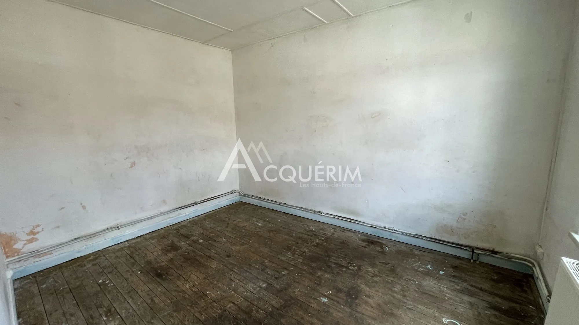 Immeuble de 120 m² à vendre à Carvin, idéal pour activité commerciale 