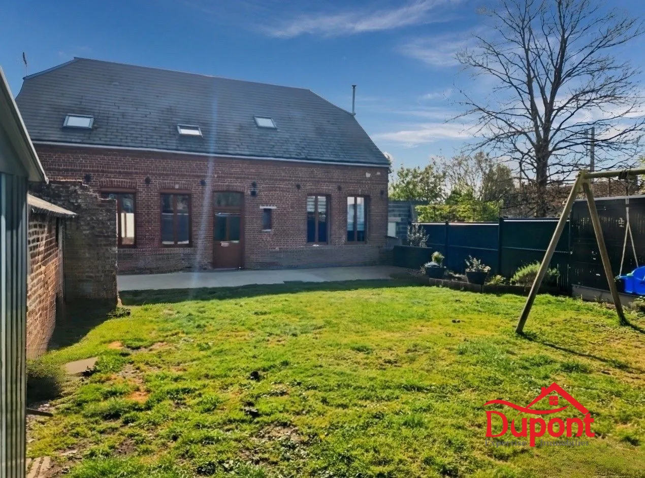 Maison familiale rénovée avec jardin et garage à Troisvilles 