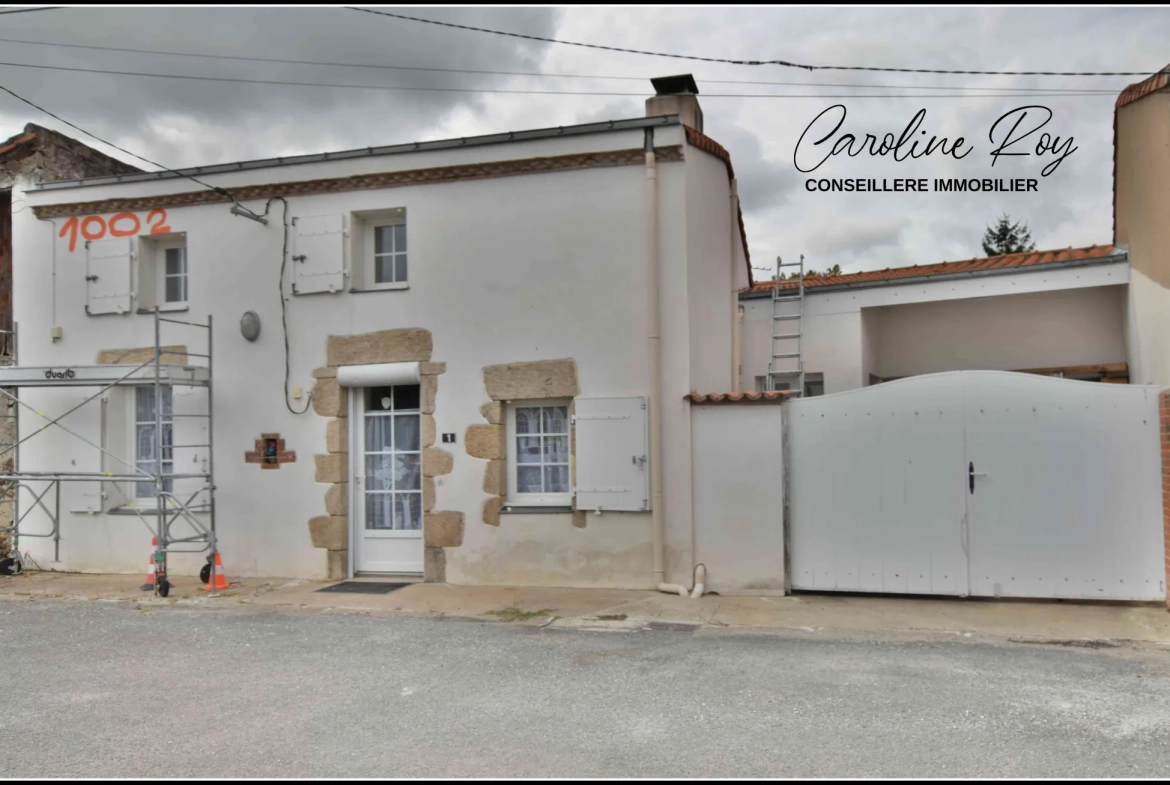 Maison de village à Vieillevigne avec 2 chambres, garage et cour - Opportunité idéale 