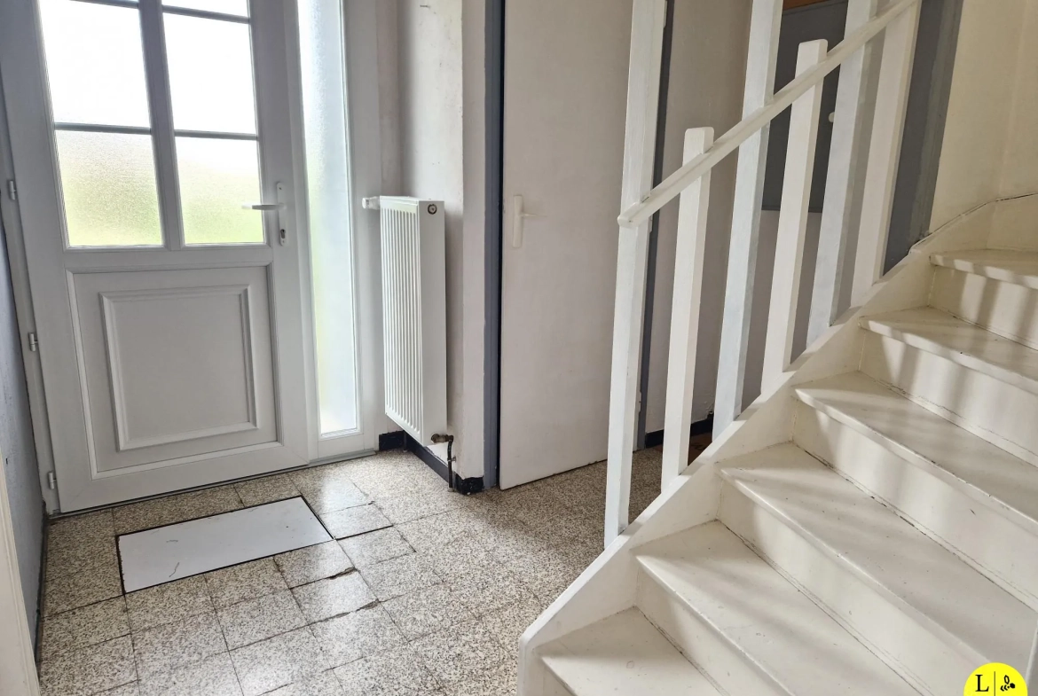Maison mitoyenne 3 chambres avec jardin et garage à Arras 
