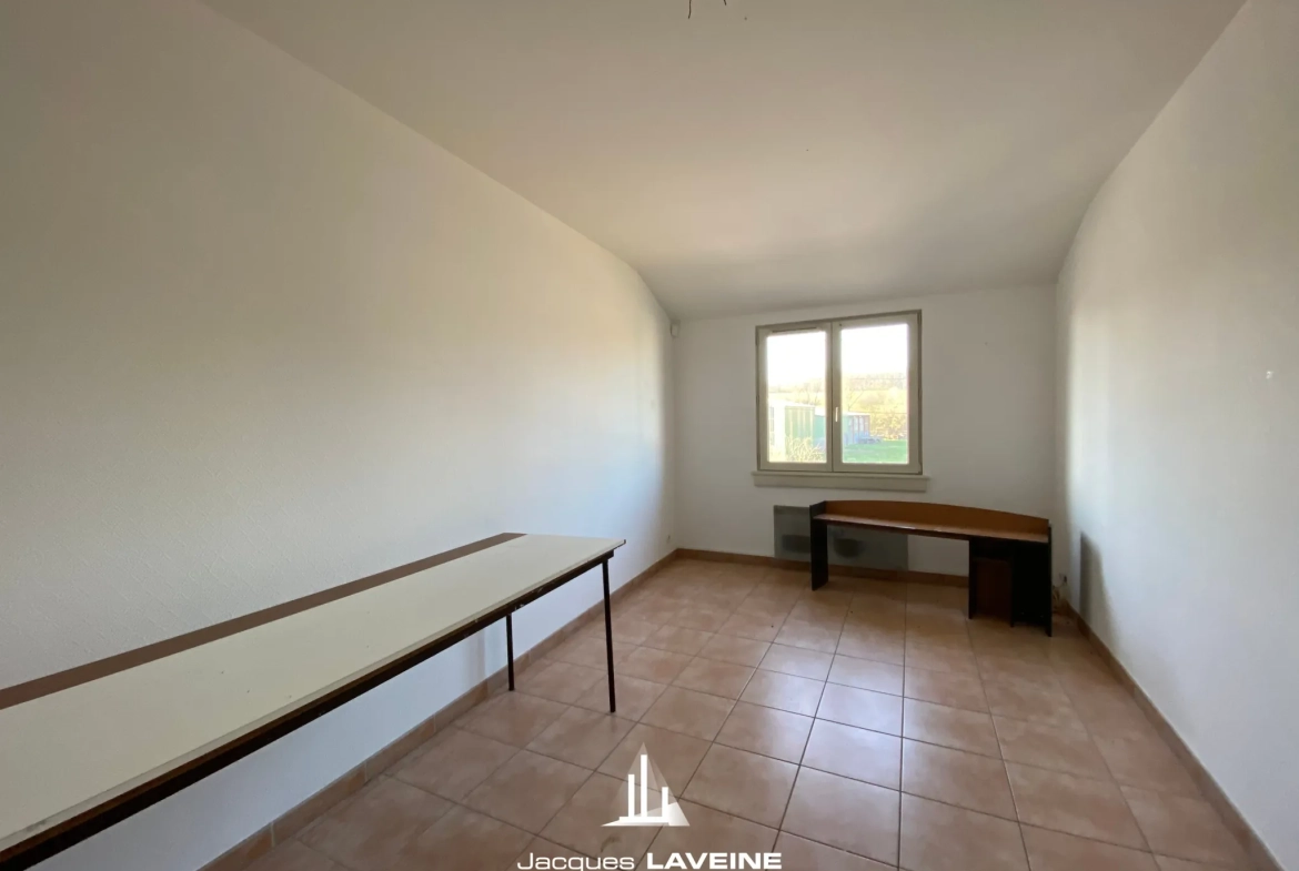 Ensemble immobilier à Sorbey à 15 km de Metz avec 2 maisons, 9 pièces et garages 