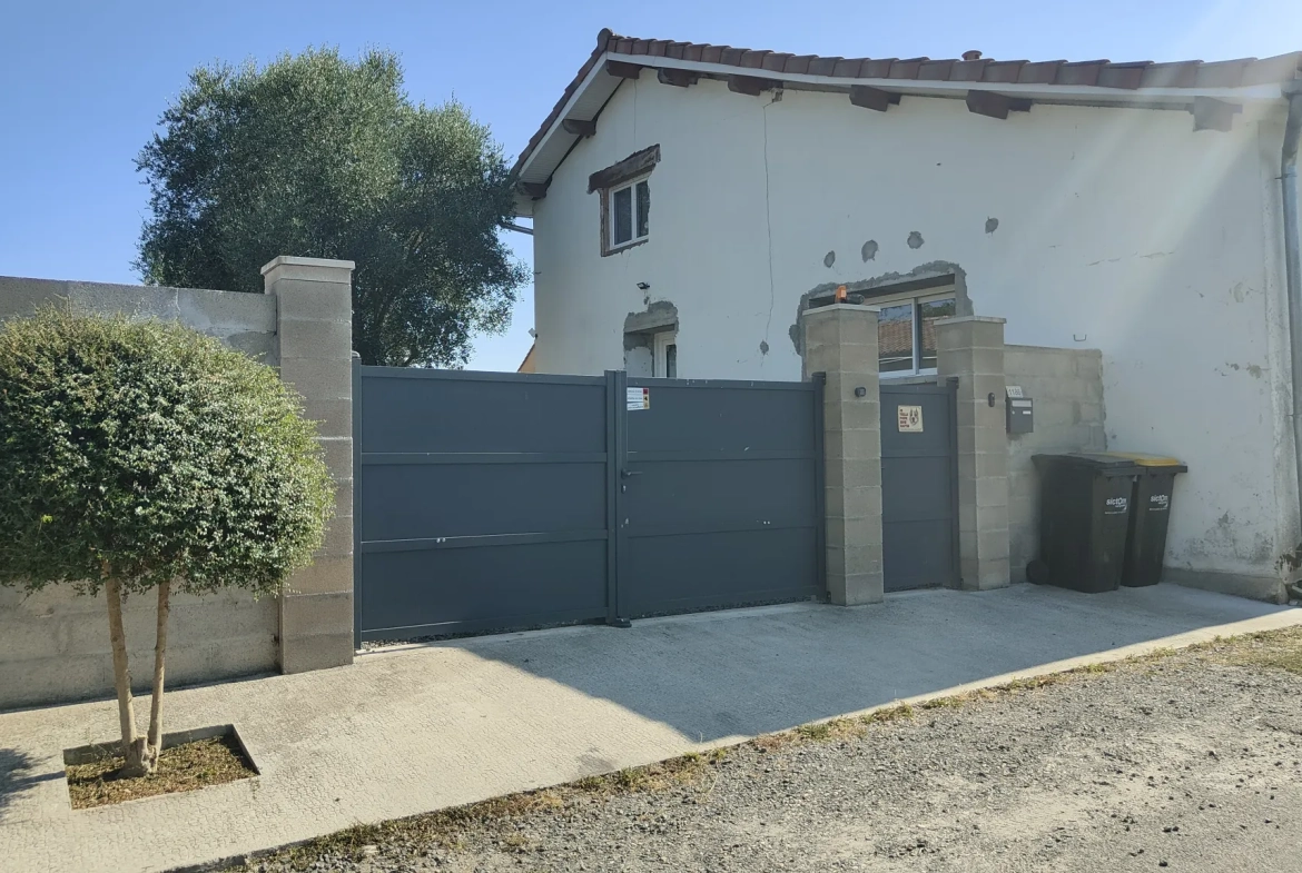 Maison en pierre rénovée de 170 m² avec 4 chambres, garage et jardin proche de Langon 