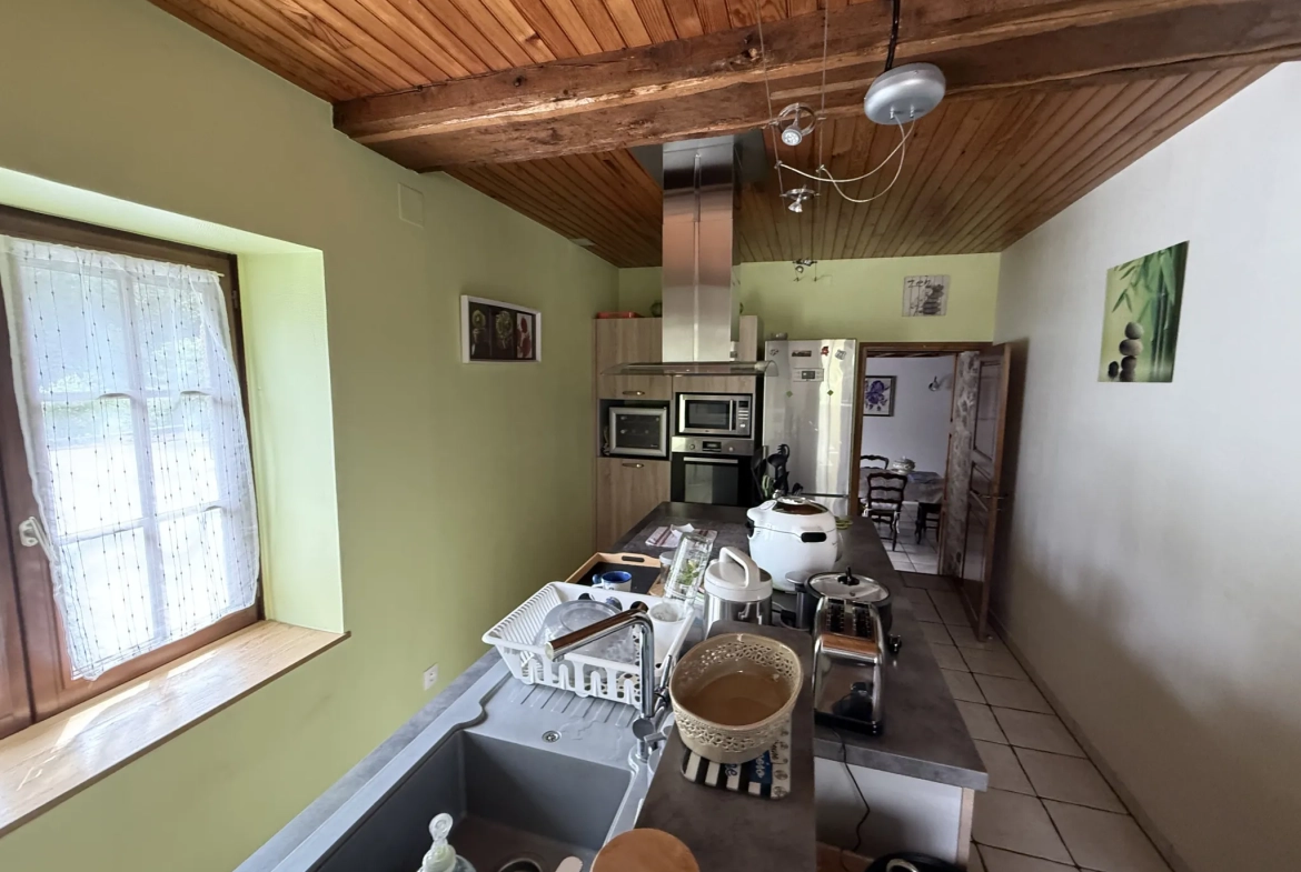 Maison en pierre de 142 m² à Saint Pierre des Nids avec terrain et garage 