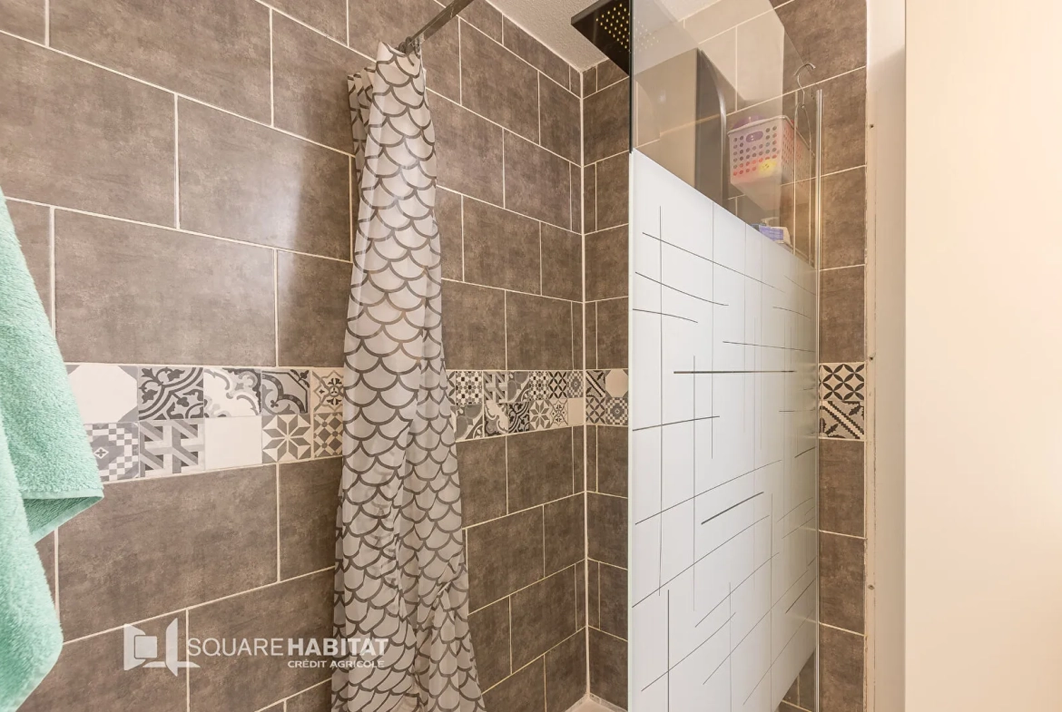 Appartement de 97m2 à Gap avec jardin, garage et cave, proche du centre-ville 