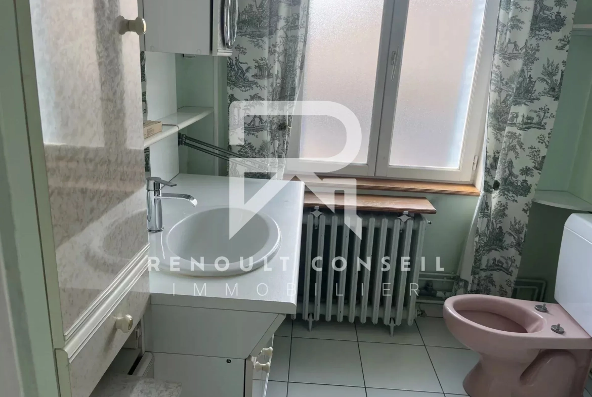 Maison en brique avec 3 chambres à Sotteville-lès-Rouen, confort moderne et extérieur convivial 