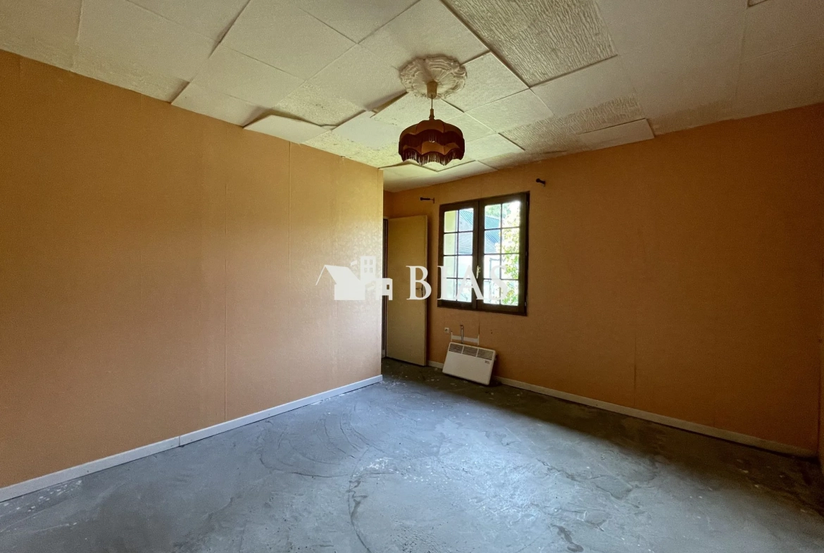 Maison de plain-pied à vendre au Neubourg avec garage et terrain spacieux 