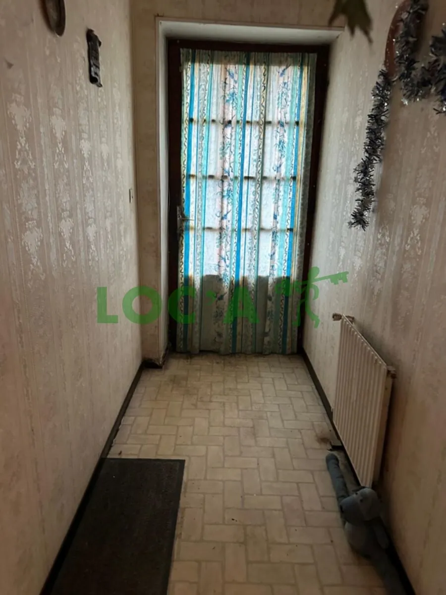 Maison mitoyenne de 75 m² à Genlis à rénover avec jardin 