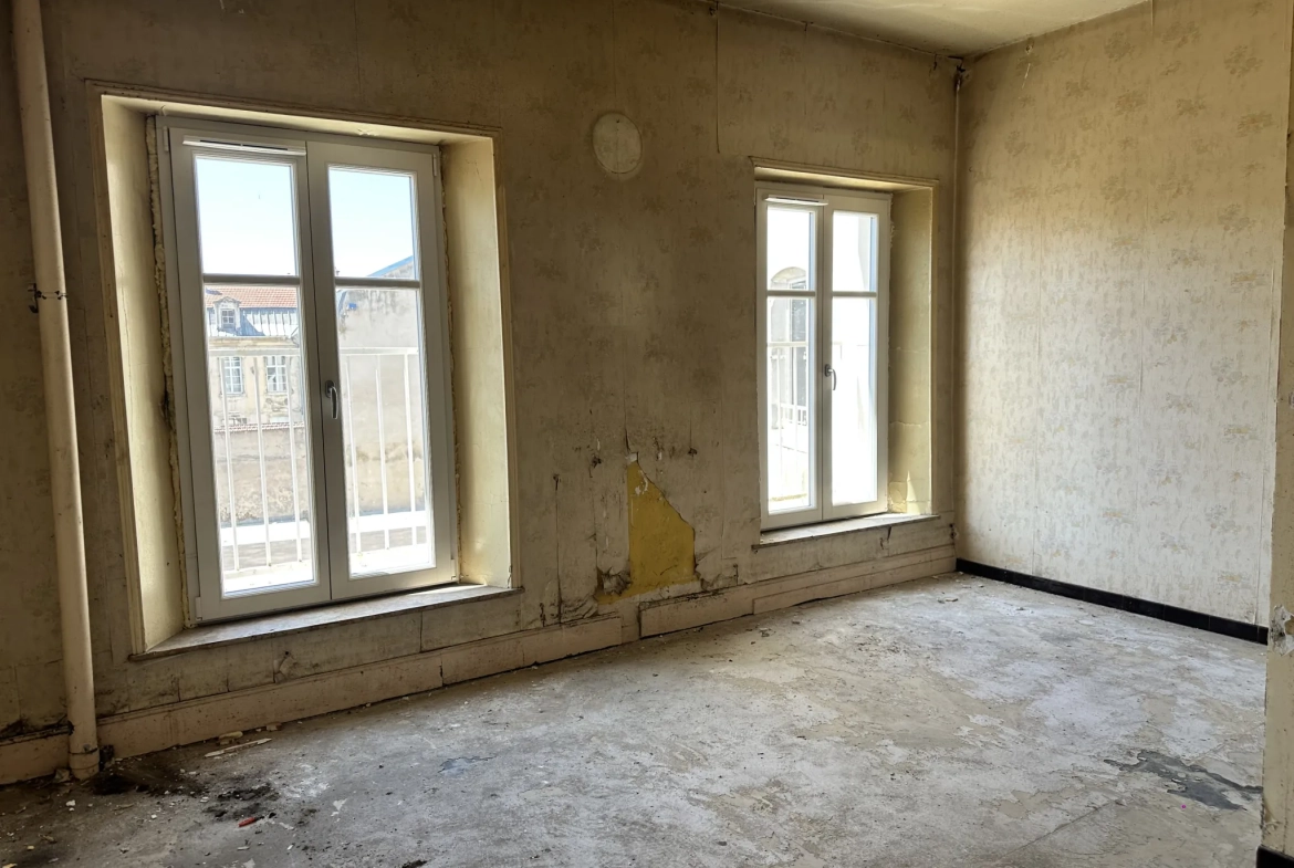 Appartement F3 à Toul de 107 m² avec fort potentiel de rénovation 