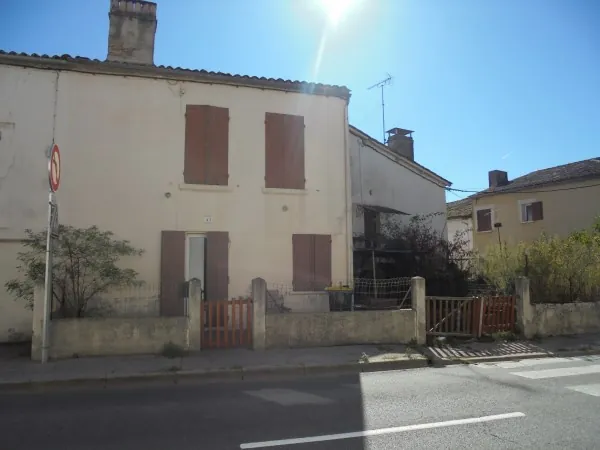 Ensemble immobilier avec 2 maisons, garage et jardin à La Réole 