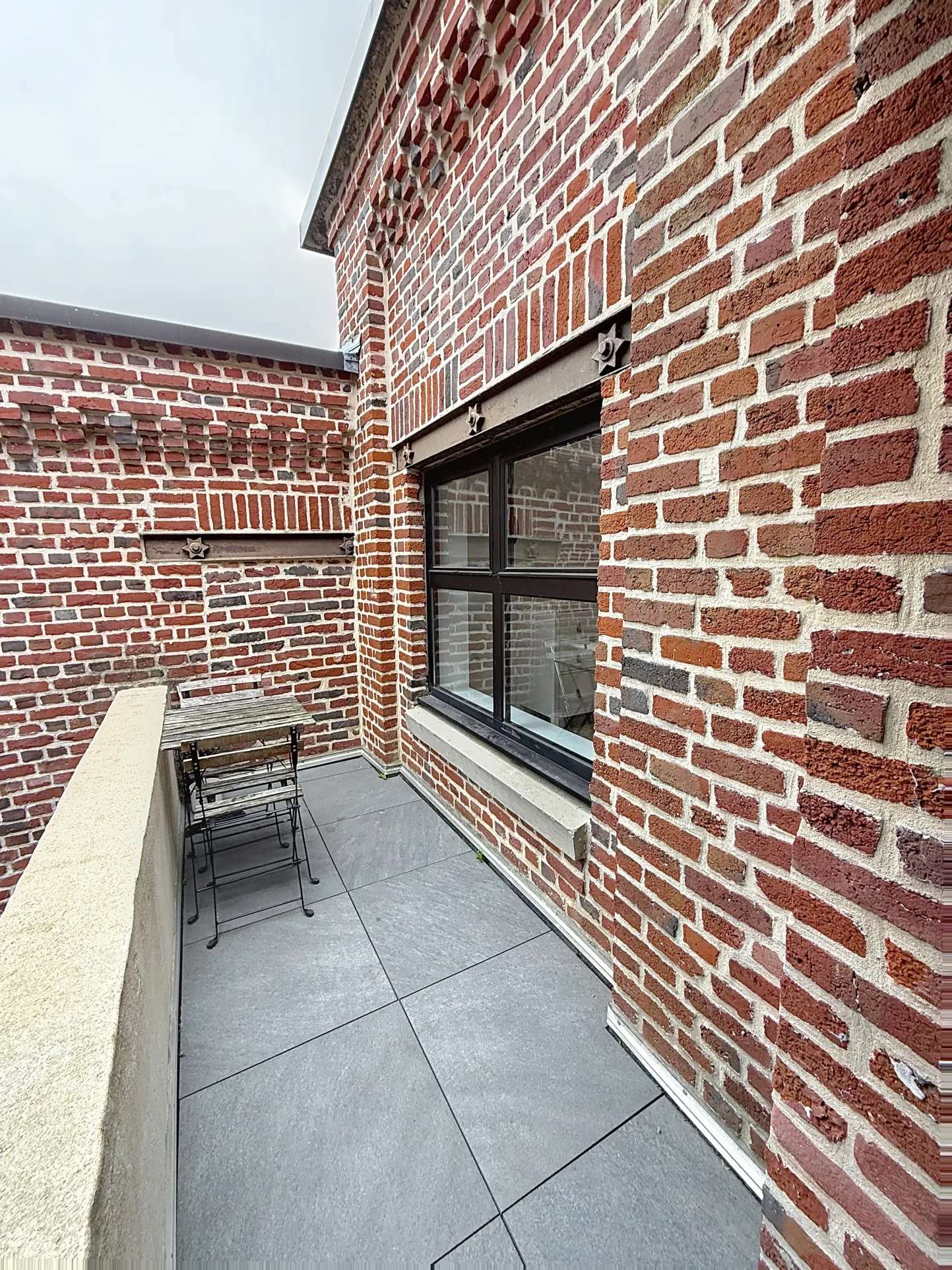 Magnifique loft à vendre à Tourcoing avec terrasse, parking sécurisé et charme industriel 