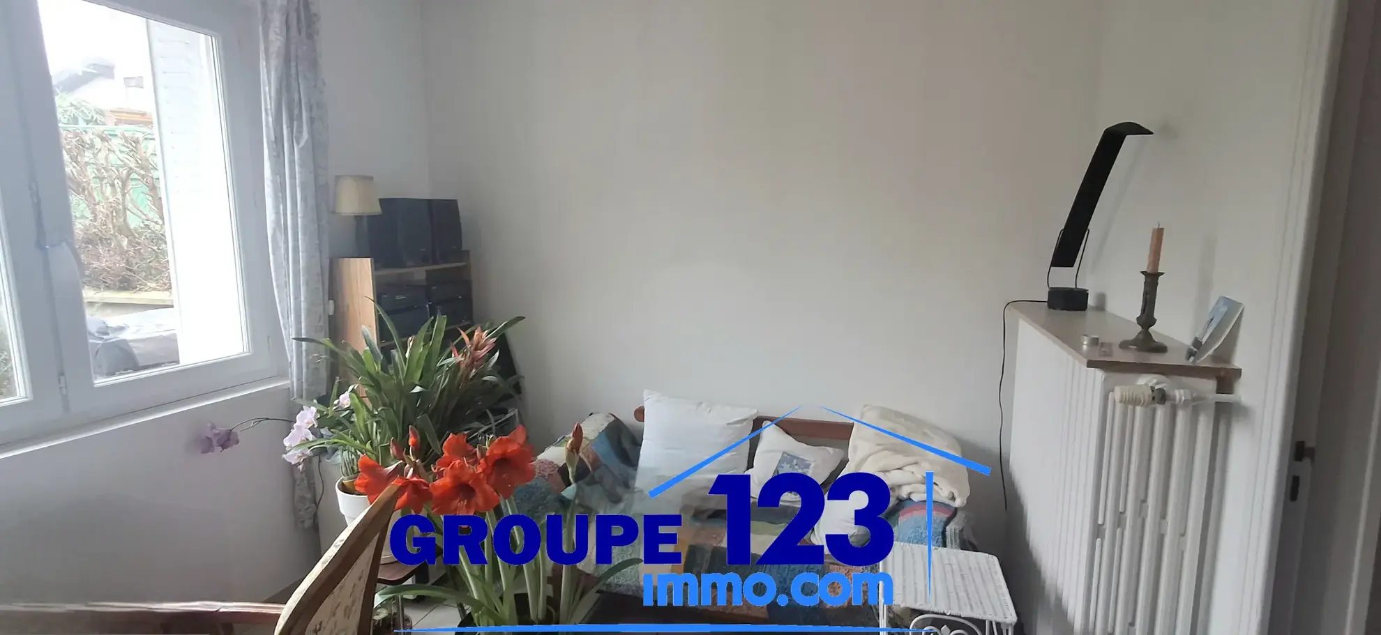 Ensemble immobilier à Auxerre avec deux maisons jumelées, jardin et stationnements 