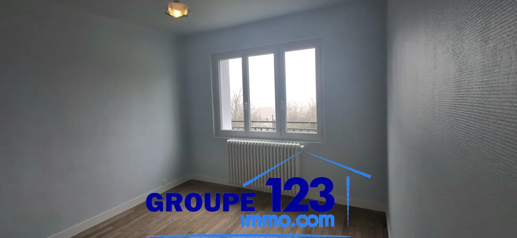 Ensemble immobilier à Auxerre avec deux maisons jumelées, jardin et stationnements 