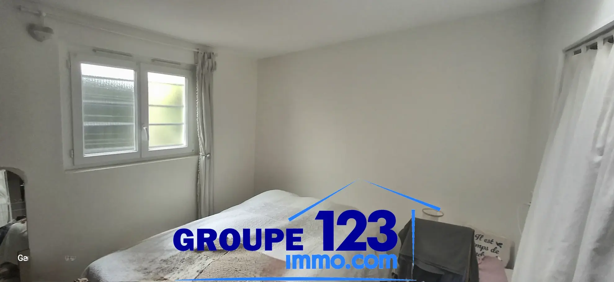 Ensemble immobilier à Auxerre avec deux maisons jumelées, jardin et stationnements 