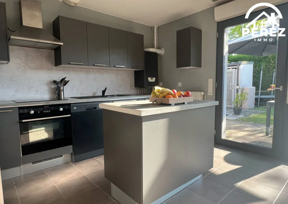 Maison familiale récente de 83 m² avec jardin et garage à Comines 