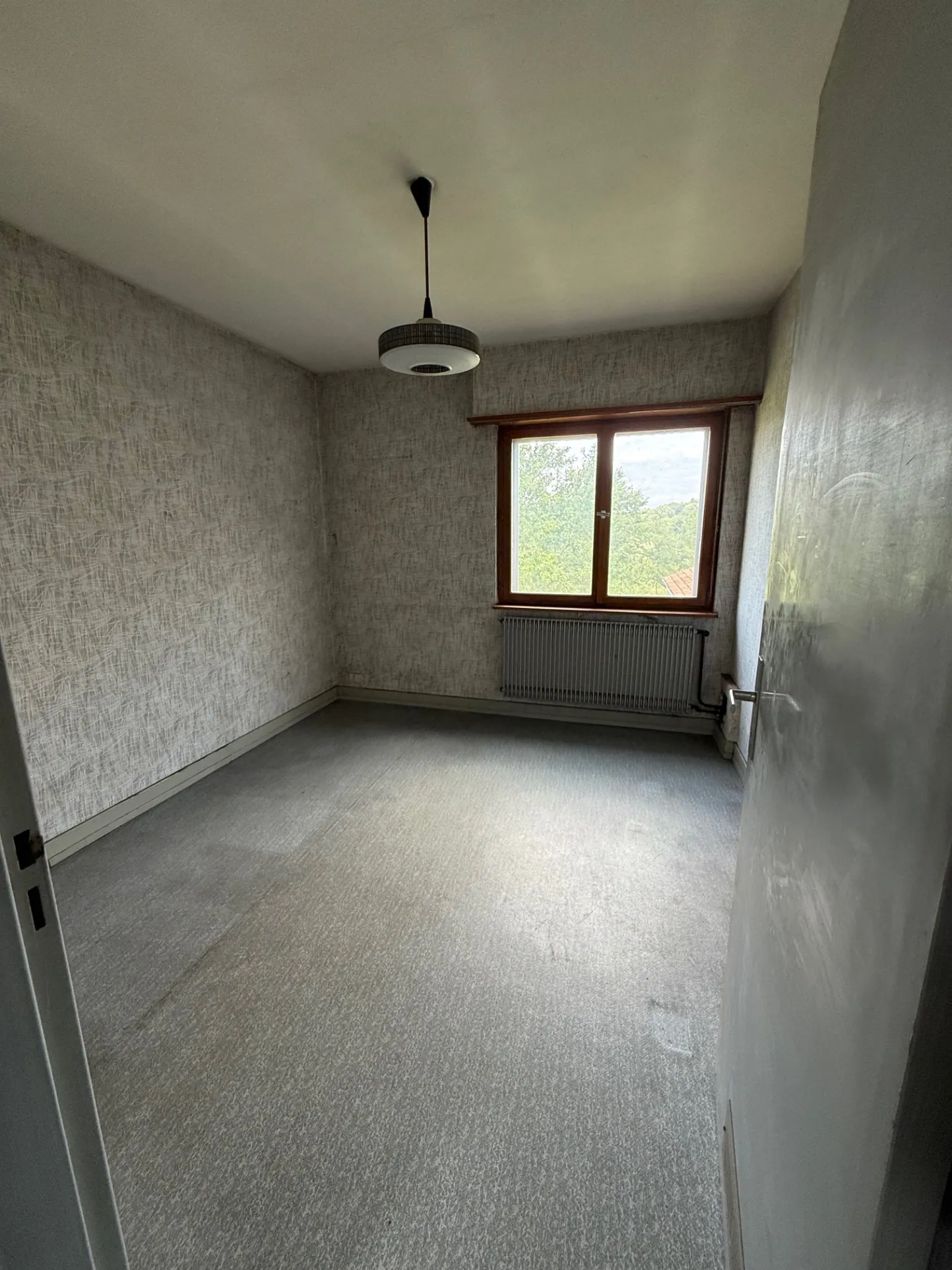 Maison à rénover à Zillisheim avec garage et jardin sur 5.59 ares 