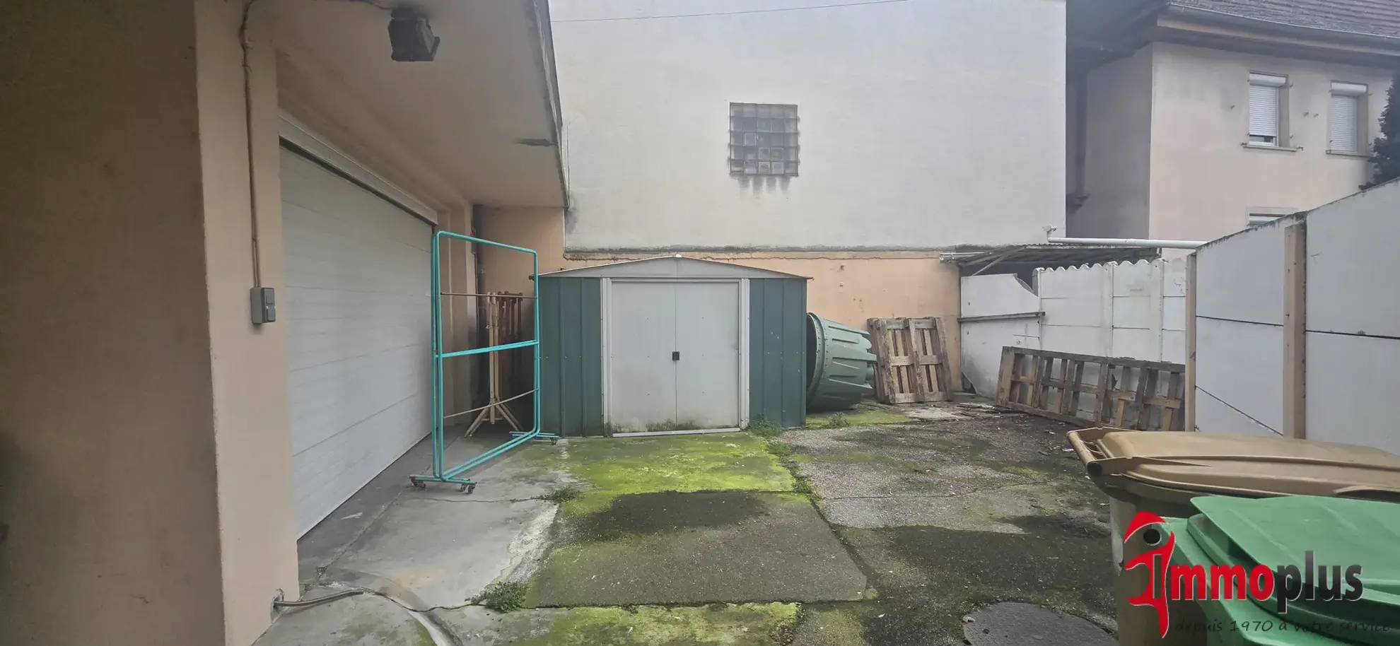 Opportunité d'investissement à Bartenheim : immeuble avec appartement et local commercial loués 