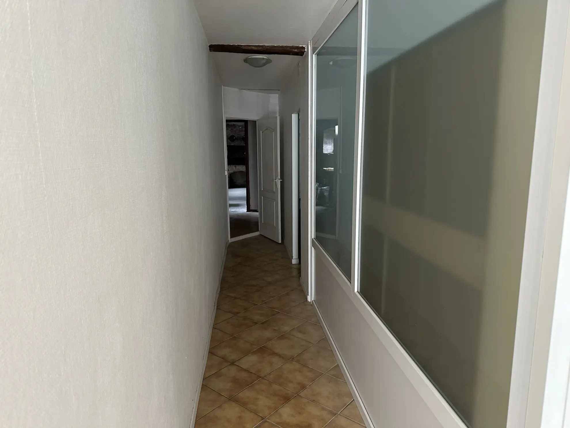 Maison à vendre à Lasseube avec local commercial, grand terrain et potentiel de développement 