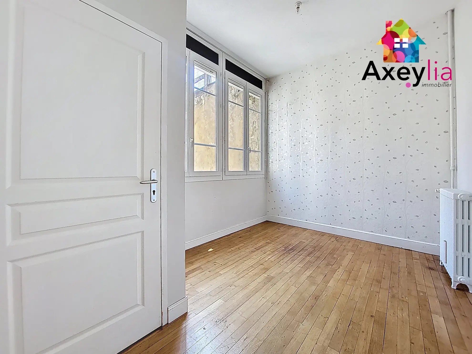 Appartement T5 rénové en hyper-centre de Roanne avec cave et charme haussmannien 